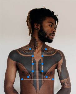 Blue dots outlining the percussion sites and pattern on a person's chest.