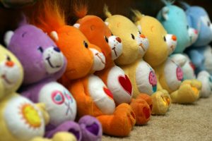 Eight Care Bears in a line up