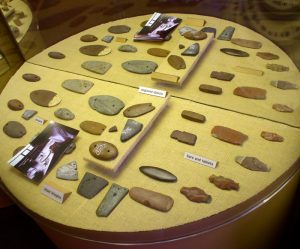 This shows a small sample of the array of different stone artifacts found at the Poverty Point Archeological Site.