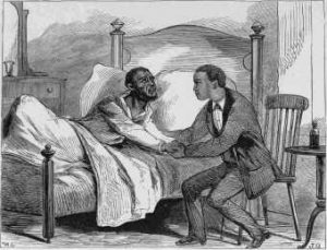 Two men embracing hands. One is laying in bed on the left and the other is sitting in a chair.