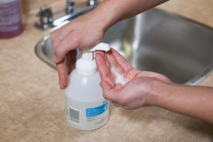 Hand hygiene done using hand gel with an alcohol-based sanitizer